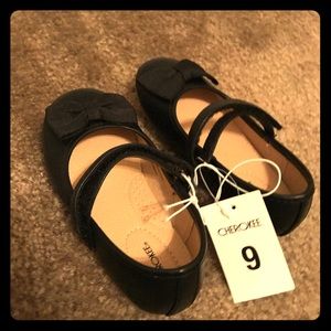 Little girl black shoes with a bow